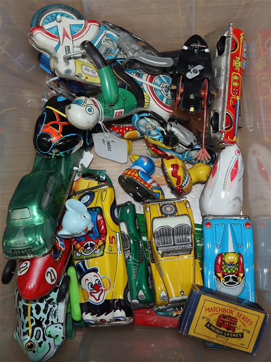 A Chad Valley tinplate racing car and a collection of other tinplate clockwork models,